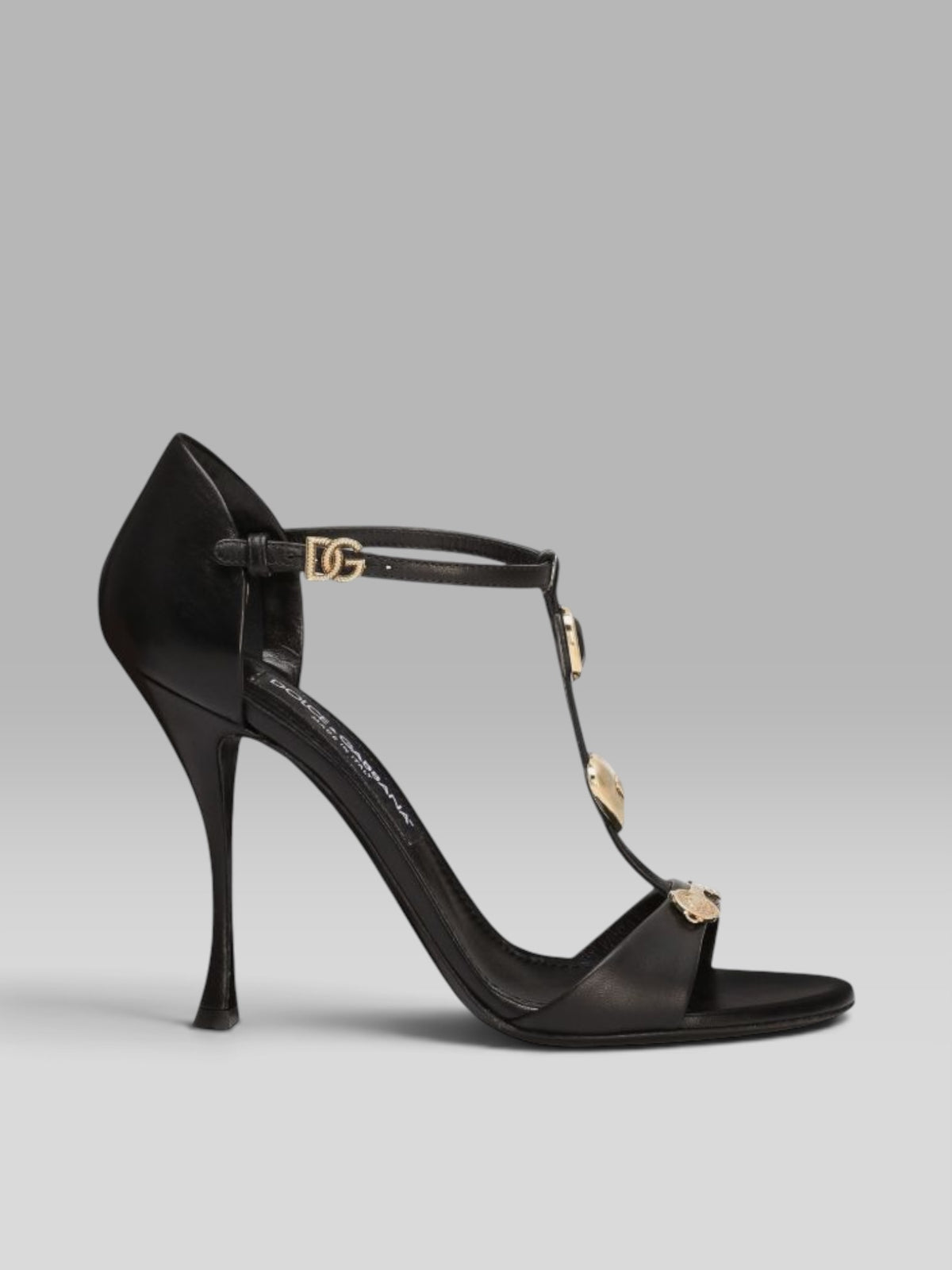 1.Dolce & Gabbana Black Leather T-Bar Sandals with Gold-Tone Charms & DG Buckle
