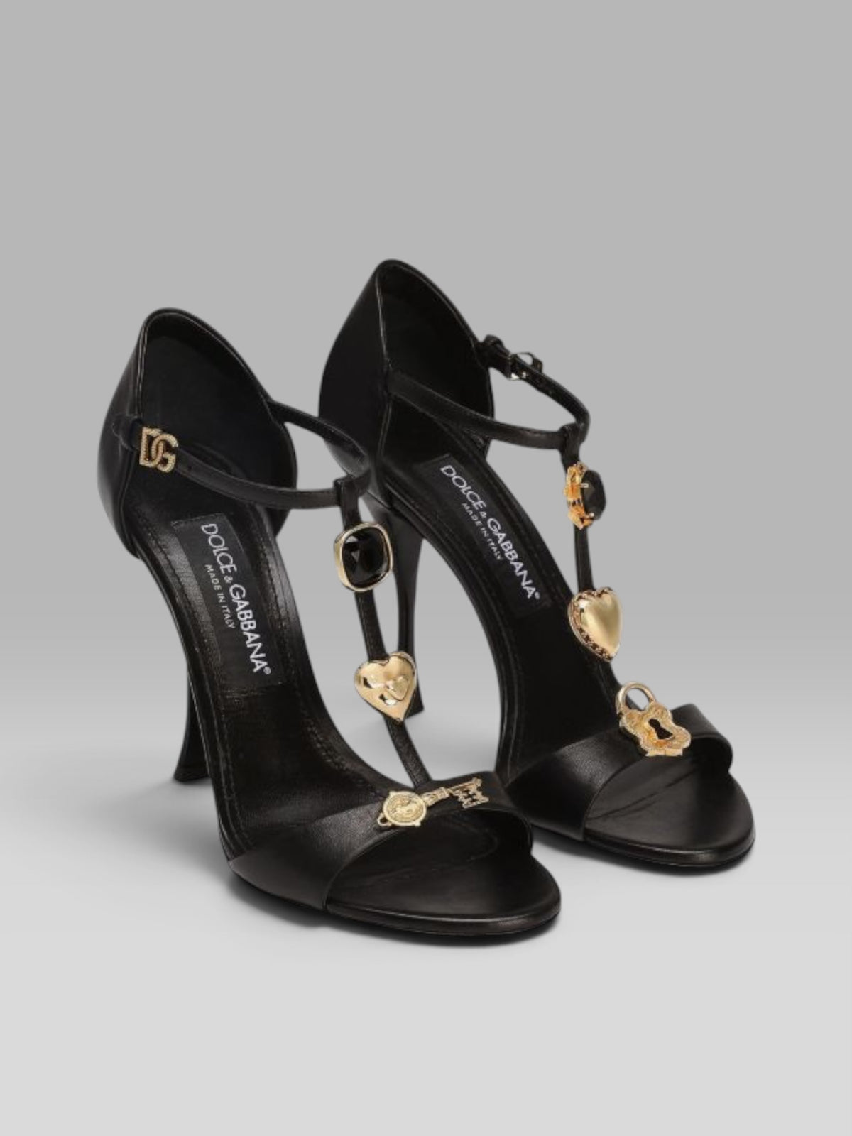 1.Dolce & Gabbana Black Leather T-Bar Sandals with Gold-Tone Charms & DG Buckle