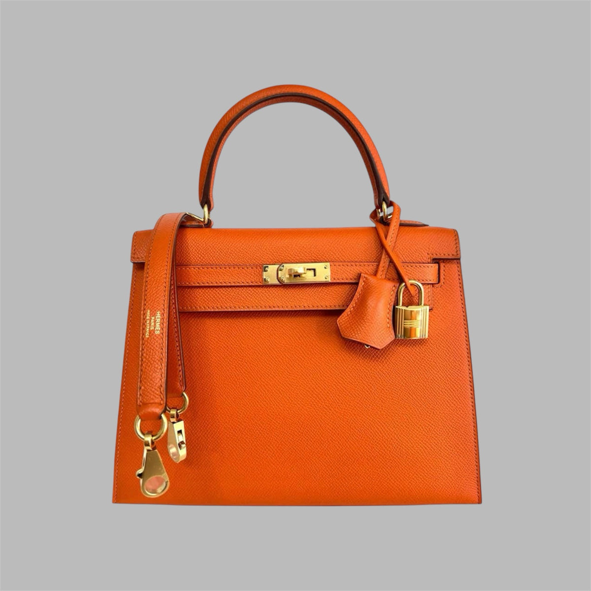 Hermès Kelly 25 retourne handbag strap in Orange Feu Togo leather , GHW